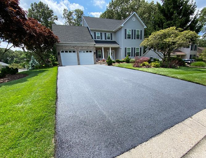 Boston Flooring providing professional driveway paving services with concrete, asphalt, and paver options.